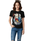 A woman wearing a black Harley Quinn Graphic T-Shirt featuring a vibrant "Harley Queen" playing card aesthetic and colorful comic-inspired art.